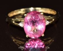A 9k gold ring set with a pink topaz and diamonds, 1.8g, size P
