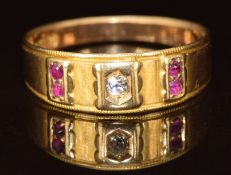 A 15ct gold ring set with an old cut diamond and rubies, Chester 1885, 2.7g, size N/O