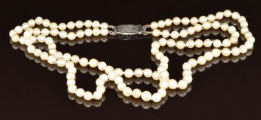 A double strand of cultured pearls with silver clasp, 29.5g, 38cm