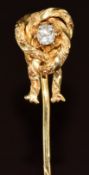 Victorian yellow metal stick pin set with an old cut diamond of approximately 0.15ct in a bow