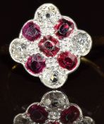 A c1915 18ct gold ring set with five rubies and four old cut diamonds, each approximately 0.2ct, 2.