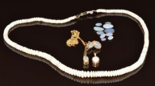 A 9k gold pendant set with a Lightning Ridge black opal and topaz on 9ct gold chain, a 9ct gold