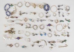 Thirty seven pairs of silver earrings including hoops, turquoise, amethyst, tanzanite, etc