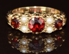 A 9ct gold ring set with garnets and pearls, 3.5g, size M