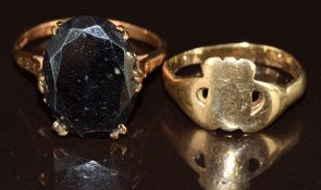 A 9ct gold ring set with hematite (4.3g, size P) and a 9ct gold ring (1.9g, size K)
