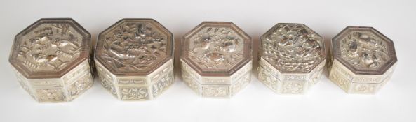 Five Chinese, Burmese or similar octagonal silver trinket pots with embossed lids lids depicting