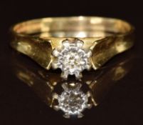 An 18ct gold ring set with a diamond in an illusion setting, 3.6g, size Q