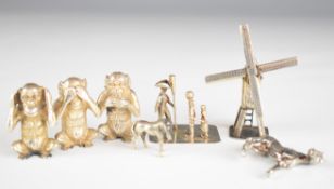 Seven Dutch and other novelty miniature silver items comprising windmill, figures on base, set of