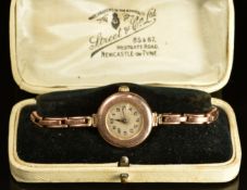 Rolex 9ct gold ladies wristwatch with blued hands, black Arabic numerals, silver dial and signed