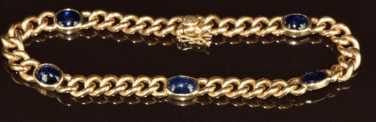 An 18k gold bracelet set with five sapphire cabochons, each approximately 1.5ct, 27.4g, 20.5cm