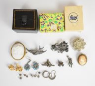 A collection of jewellery including silver and marcasite brooches, monkey brooch set with paste,