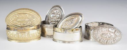 Four Chinese, Burmese or similar silver lozenge shaped trinket pots, two having signature/dog to
