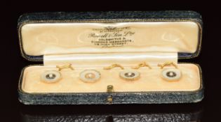 Four 9ct & 18ct gold studs / buttons each set with mother of pearl and a seed pearl, in original