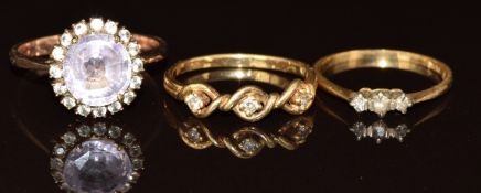 An 18ct gold ring set with cubic zirconia and diamonds, a 14k gold ring set with diamonds and a
