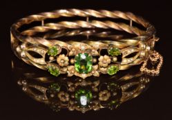Edwardian 9ct rose gold rope twist bangle set with garnet doublets and seed pearls amongst floral