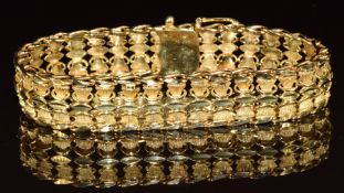 A yellow metal bracelet, tests as 14k gold, 34.1g, 19cm