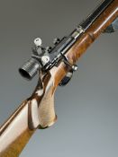 Anschutz KK Junior .22 bolt-action target rifle with chequered semi-pistol grip, raised cheek piece,