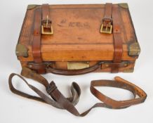 Leather and brass bound shotgun cartridge magazine with fitted interior, 40.5x28x12cm.