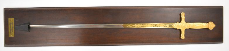 Franklin Mint replica sword of Napoleon I, on display board with plaque lower edge, overall height