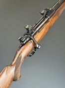 Heym 8x57 bolt-action rifle with chequered semi-pistol grip and forend, sling and scope mounts,