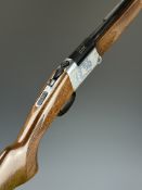 Italian .410 folding over and under shotgun with engraved scenes of birds to the locks, chequered