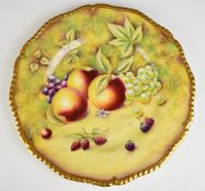 Royal Worcester painted fruit cabinet plate with gadrooned and gilded rim, signed Cox, diameter