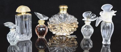 Six Lalique/ Nina Ricci glass scent bottles four with bird stoppers, all signed or with original
