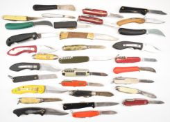 Thirty various pocket knives including Swiss Army, Rostfrei, Wilkinson etc. PLEASE NOTE: WE ARE