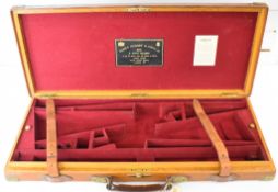 James Purdey & Sons brass and leather bound oak double shotgun carry case with fitted interior