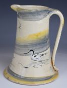 Jethro Jackson studio pottery jug decorated with wading birds, with incised signature to base, H