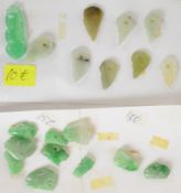 A collection of over 70 carved jade pendants and plaques including rabbits, leaves, animals,