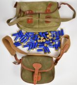 Fifty nine 16 bore Gamebore Regal shotgun cartridges in a leather and canvas cartridge bag