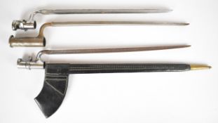 Three socket bayonets including one of heavy construction with long socket, longest blade 48cm, with