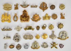 Approximately 30 cap badges including Shanghai Volunteer Corps, Norfolk Regiment, East Lancashire