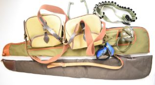 A collection of gun or shooting accessories comprising two gun slips, two shotgun cartridge bags,