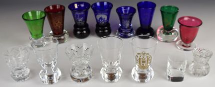 Fourteen Masonic firing glasses including Bristol Blue, cranberry etc, some with certificates,