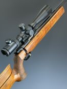 Walther .22 bolt-action target rifle with textured semi-pistol grip, adjustable butt plate, cheek