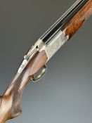 Browning 12 bore over and under ejector shotgun with engraved scenes of birds to the locks, engraved