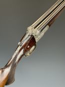 German 16 bore side by side shotgun with heavily engraved scenes of birds and rabbits to the