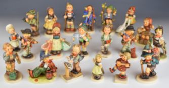 Twenty Goebel Hummel figures including Heartfelt Gift, Spring Waltz and Band Leader, tallest 15cm