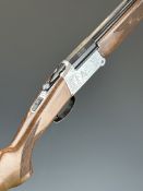 Italian 28 bore folding over and under shotgun with engraved scenes of birds to the locks,