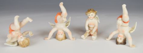 Four Volkstedt / Dresden porcelain cherub / putti figures, H6cm