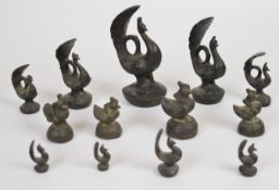 Thirteen Indian / Eastern bronze peacock and bird weights, some graduated, tallest 13cm