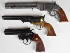 Three replica guns comprising two revolvers and a Winchester style lever action pistol marked