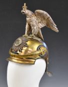 Imperial German Gardekorps helmet with crowned eagle finial, chinstrap above peak and lobster