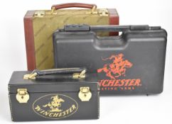 Three Winchester ammunition cartridges/ carry cases, one faux leather, one canvas and leather