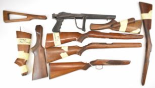 Nine various shotgun and rifle stocks including including a composite folding example for a Ruger