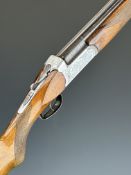 Marocchi 12 bore over and under shotgun with engraved birds to the locks and underside, engraved