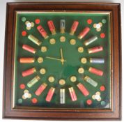 Shotgun cartridge shop or advertising display board in the form of a clock featuring Eley, E J