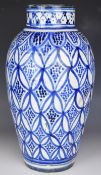 Indian / Eastern blue and white pottery vase with faint script to base, H39cm